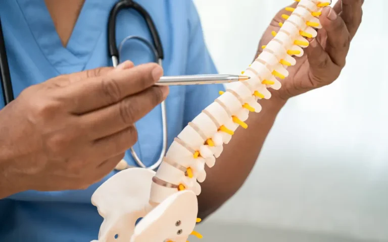 Ayurvedic doctor discussing herniated lumbar disc treatments.